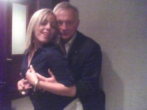 Jones holding blonde woman's boobs from behind