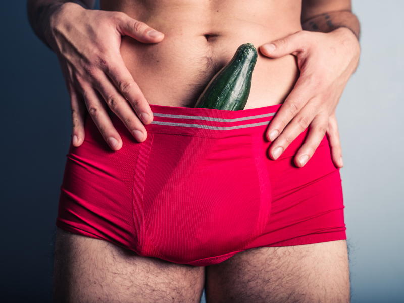 Man with cucumber in his pants
