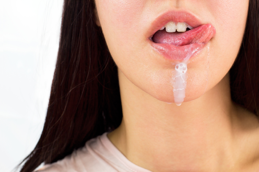 Woman with cream running from her lips