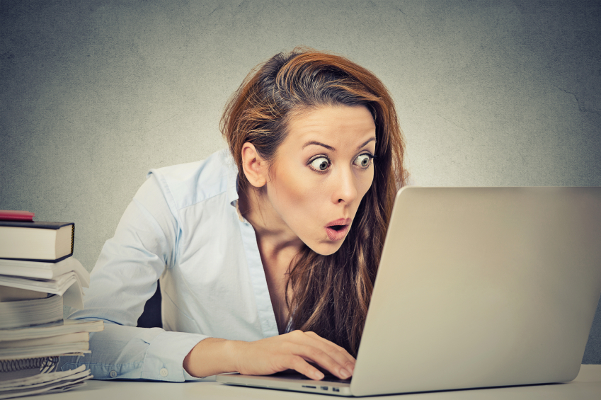 A woman looking shocked after reading about a prostitute who became stuck to a client!