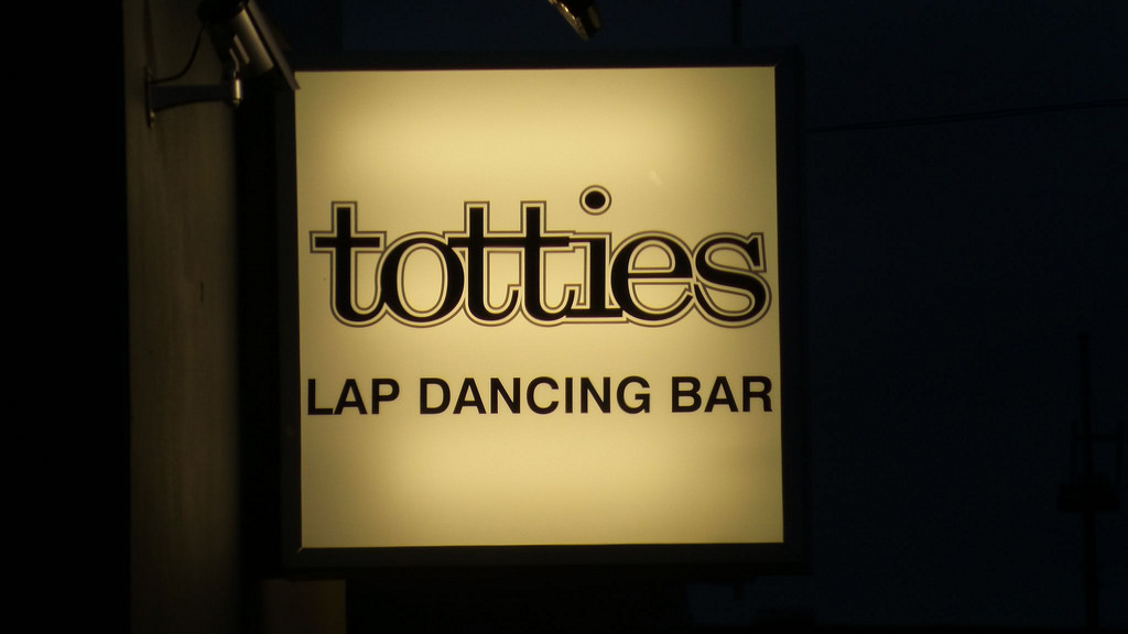 Totties strip club sign