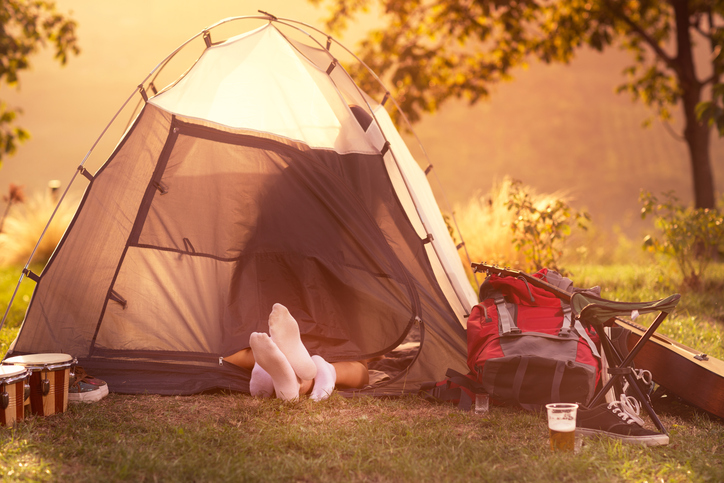 Young couple having sex in tent