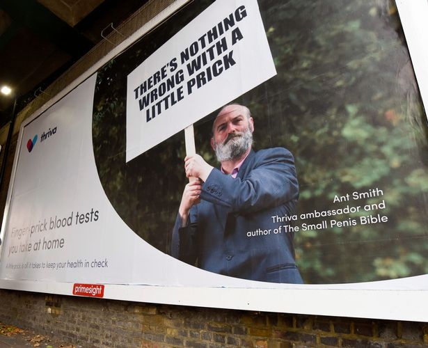 small penis man on billboard with placard