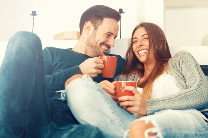 happy couple on couch