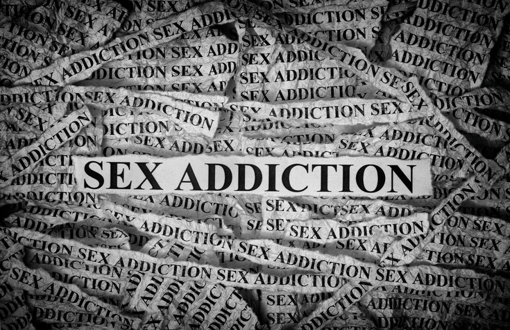 Sex Addiction. Torn pieces of paper with the words Sex Addiction. Concept Image. Black and White. Closeup.
