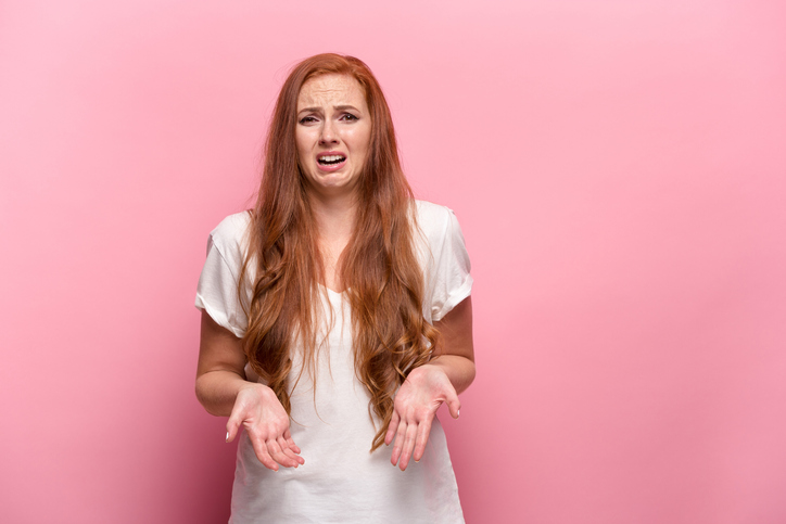 woman looking shocked